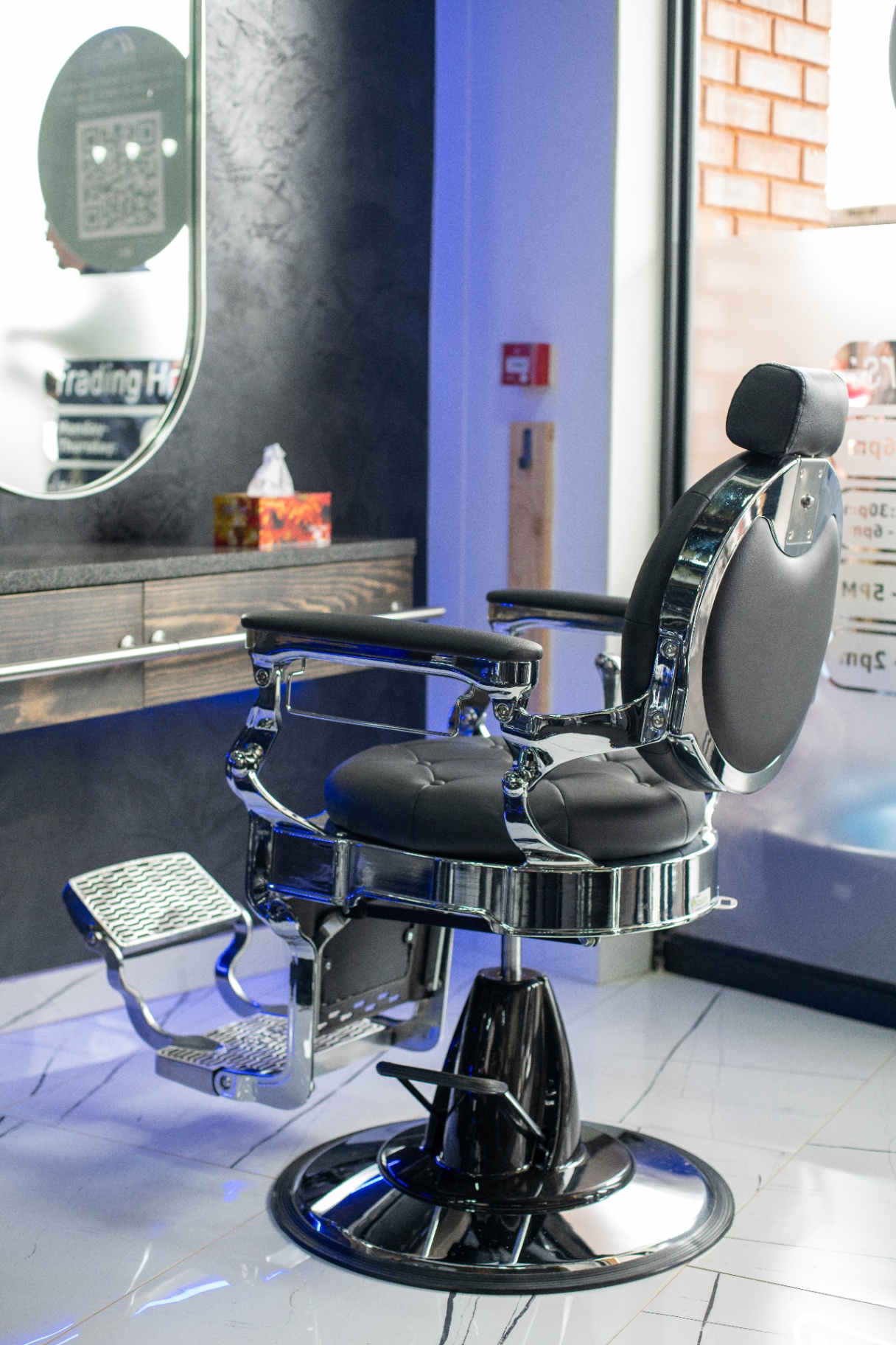 Signature chrome barber chair in the studio