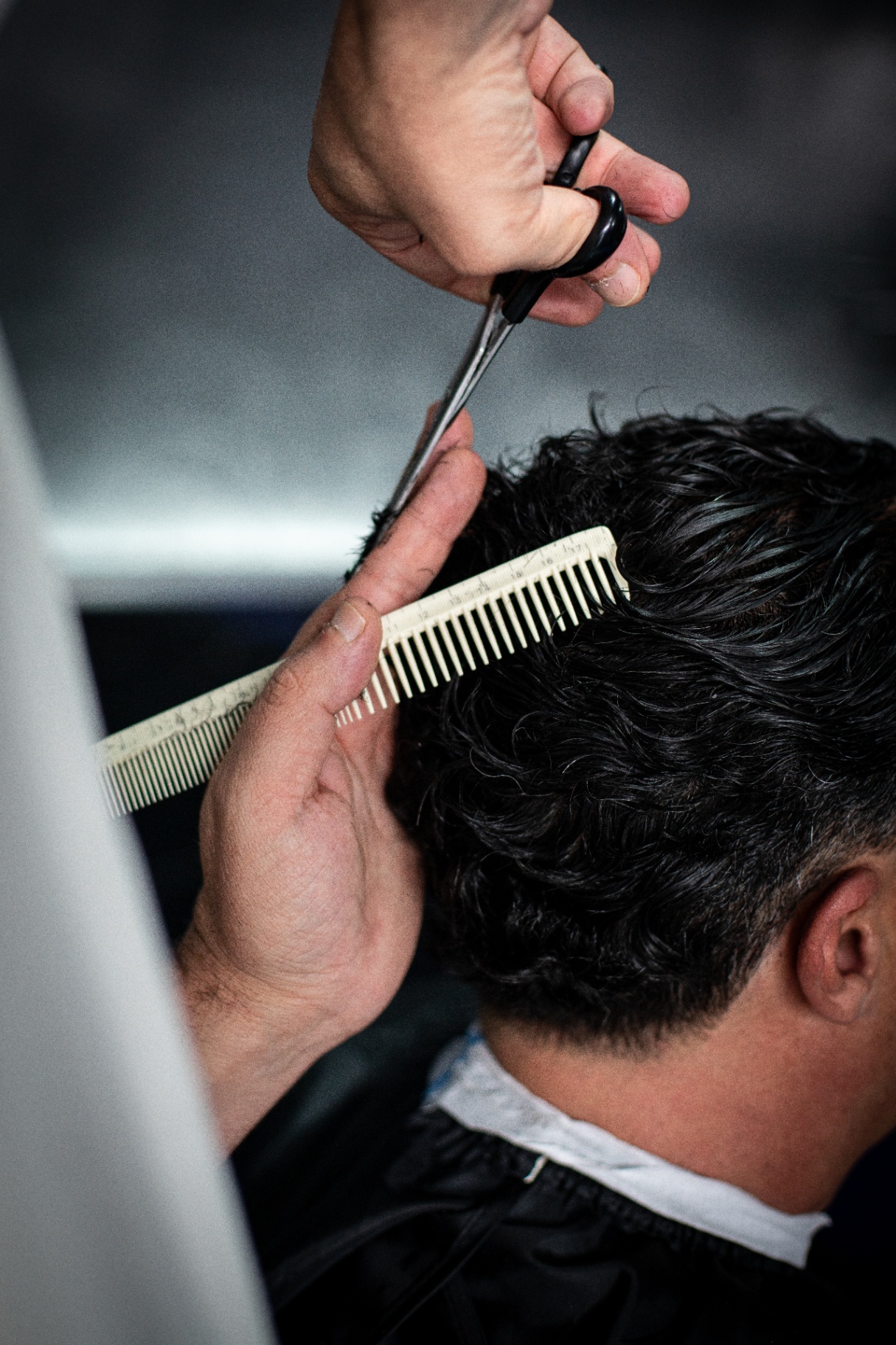 Precision scissor work on textured hair
